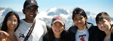 Five Թϱ students pose in front of mountains.